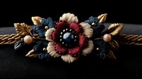 Vintage floral brooch with burgundy, beige and navy blue flowers adorned with golden leaves and pearls on twisted rope against dark background. Antique jewelry macro.