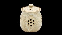 Rustic ceramic garlic keeper jar with lid and ventilation holes, isolated on transparent background. Great for kitchen clipart, stickers, print on demand, and T-shirt design.