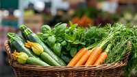 Fresh organic vegetables in wicker basket at farmers market, including cucumbers, carrots, and leafy greens, ready for healthy cooking and meal preparation.