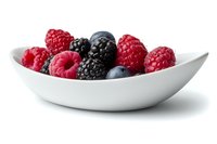 Fresh mixed berries including raspberries, blackberries and blueberries in white ceramic bowl against white background, healthy organic summer fruit.