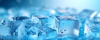 Melting ice cubes with water droplets on blue background, creating refreshing cool atmosphere for beverage advertisements.