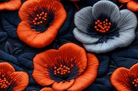 Vibrant orange and gray floral arrangement with detailed petals and stamens on dark background, featuring dramatic contrast and intricate textile-like texture.