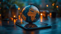 Illuminated world globe on digital tablet with glowing bokeh lights in dark background creating magical atmosphere for travel and technology concept.