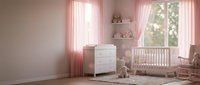 Cozy pink nursery room interior with white crib, dresser and floating shelves. Soft natural lighting through window creates warm atmosphere for baby care.