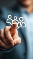 Businessman touching digital people icon, representing team management, HR solutions, and social networking for business growth.