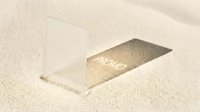 Transparent promo card standing in fine sand, casting a sharp shadow, minimal summer concept for branding, marketing, and promotional design mockups.