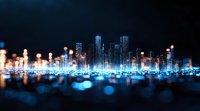 Glowing futuristic cityscape with illuminated skyscrapers reflecting in water at night, blue bokeh lights creating dreamy urban atmosphere for business backgrounds.