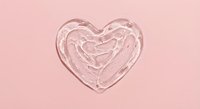 Clear glass heart-shaped bowl with swirled pattern on soft pink background for romantic decor, wedding planning, and Valentine's Day designs.