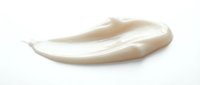 Smooth beige cosmetic cream smear isolated on white background for skincare and beauty product design applications.