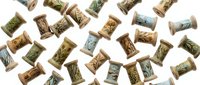 Scattered wine corks with vineyard landscapes printed on surface creating rustic pattern on white background for winery branding and beverage design projects.