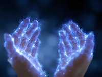 Glowing blue energy surrounds raised hands against dark background, creating magical ethereal effect with sparkles and light trails for spiritual and wellness concepts.