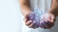 Hands holding glowing family figures representing protection, care and insurance coverage for loved ones in healthcare and life planning concepts.
