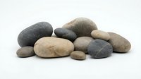 Collection of smooth river rocks and pebbles in natural earth tones isolated on white background for spa, meditation, and wellness design projects.