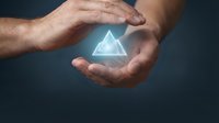 Caucasian male hands holding glowing neon triangle symbol against dark background, representing digital innovation, technology protection, and business growth concepts.