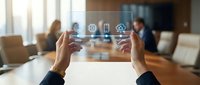 Businessman hands holding transparent screen with smart home technology icons in modern office environment for digital automation solutions.