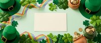 Blank white card surrounded by green leprechaun hats, gold ribbons, shamrock leaves, and coins on mint background for St. Patrick's Day greeting designs.