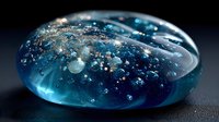 Mesmerizing blue glass paperweight with suspended bubbles and sparkles against dark background, perfect for luxury decor or cosmic inspiration.