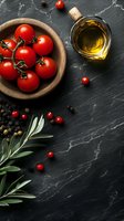 Fresh cherry tomatoes in wooden bowl with olive oil, peppercorns, and rosemary on dark slate background for Mediterranean cuisine.