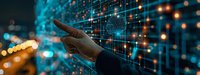 Businessman touching digital data visualization panel with glowing network connections and analytics information against blurred city lights background.