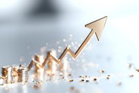 Stacks of golden coins with upward arrow showing financial growth and success, sparkles and bokeh effects create magical money atmosphere.
