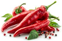 Fresh red chili peppers with water drops, green leaves and scattered peppercorns on white background, perfect for cooking, food packaging and menu design. Isolated composition for commercial use.