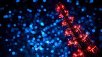 Glowing red Christmas tree silhouette against blurred blue bokeh lights background creates magical holiday atmosphere. Festive winter night scene.