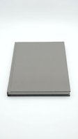 Closed hardcover notebook with gray linen fabric cover and dark spine, isolated on white background, ready for branding, mockup, and design projects.