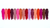 Colorful lipstick swatches in vibrant shades from pink to burgundy arranged in row on white background for cosmetic and beauty product design.