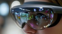 Close-up view of augmented reality smart glasses with holographic display reflection showing digital interface elements and ambient lighting effects in modern setting.