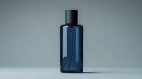 Dark blue transparent cosmetic bottle on neutral gray background, minimalist product photography for beauty and skincare packaging design and branding.
