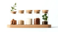 Minimalist spice storage set with glass jars, cork lids, and wooden stand displaying cinnamon sticks, ground spices, coffee beans and decorative plants on white background.