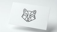 Minimalist fox head logo design in black line art style on white business card mockup for branding and corporate identity projects.