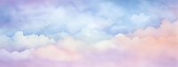 Dreamy watercolor sky panorama with soft pastel clouds in pink, purple and blue hues creates serene atmospheric background for design projects.
