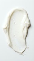 Creamy white skincare product smear isolated on light background, suitable for cosmetics, beauty, and wellness design applications.