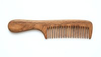 Wooden comb with handle isolated on white background, ready for haircare product design, packaging, and grooming illustrations.