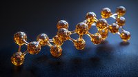 Glowing amber molecular structure against dark background showcases scientific concept with spherical nodes connected in chain formation for chemistry presentation.