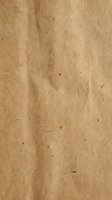 Natural brown kraft paper texture with organic fibers and rustic surface for eco-friendly packaging and vintage design projects.