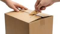 Two hands opening a sealed cardboard shipping box with tape being peeled back on white background, suitable for e-commerce, logistics, delivery, and unboxing content.