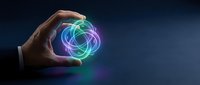 Hand holding glowing neon energy orb with vibrant blue, green, and purple light trails. Futuristic technology concept for innovation, science, and digital transformation projects.