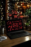 Laptop screen with glowing red email icons and symbols floating above, set on wooden desk with bokeh lights and plants, representing digital communication.