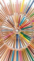 Sharpened colored pencils arranged in a circular pattern radiating from center, displaying full spectrum of hues for art, design, education and creative projects.