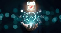 Business professional holding glowing clock with productivity icons for time management and scheduling efficiency in corporate environment.