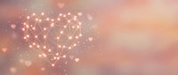 Glowing network heart shape with connected dots and lines on soft pink gradient background with bokeh lights for romantic technology concepts.
