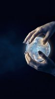 Hands holding glowing digital sphere with circuit board pattern against dark background, representing technology innovation and future digital solutions.