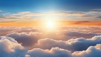Majestic aerial view above white fluffy clouds during golden sunset with bright sun and dramatic orange sky. Peaceful cloudscape scenery for spiritual concepts.