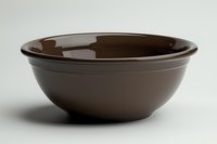 Empty brown ceramic bowl isolated on white background, suitable for food styling, kitchen product photography, tableware design, and culinary content creation.