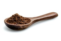 Ground coffee powder in wooden spoon on white background, close up view of fresh roasted arabica coffee grounds for brewing and cooking.