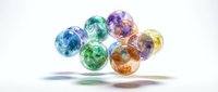 Colorful transparent glass marbles with vibrant rainbow hues floating above white surface casting soft shadows for gaming and decoration concepts.