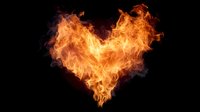 Fiery heart shape made of bright orange flames against black background for romantic and passionate design projects.