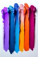 Colorful paint brush strokes in vibrant rainbow colors on white background. Creative art supplies for design projects and artistic expression.